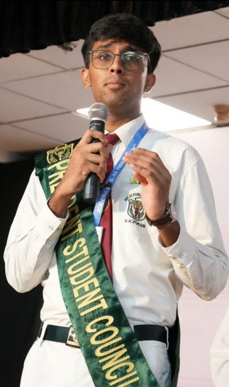Akshat Bhaskar addressing the school in the President Student Council sash